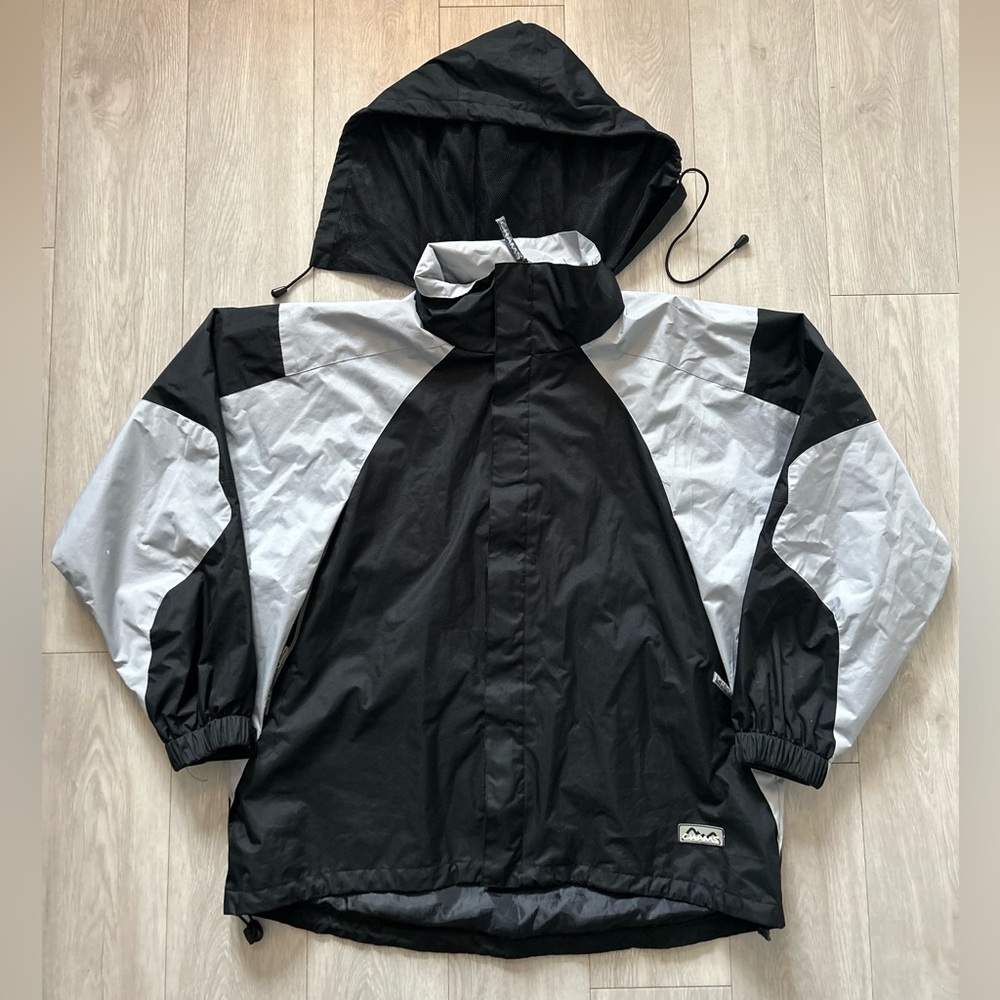Black and silver raincoat with hood by Chams size large
